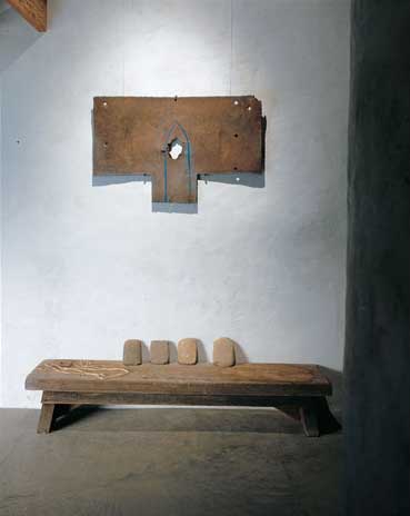 From the ancient Anasazi culture comes a collection of circa 1300 manos—grinding stones—displayed on a hand-hewn Oriental bench, here, and a Kayenta black-on-white pot, circa 1300, which rests atop a 1750’s Welsh bridal armoire, opposite.
